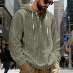 Detail shot of men's olive green striped hoodie with buttons and drawstring
