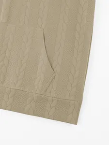 Macro detail of the braided jacquard texture on a men's heavy-weight beige hoodie