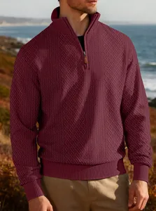 Detailed view of men's burgundy heavy jacquard half-zip sweatshirt with ribbed standing collar