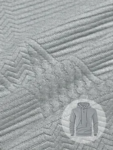 Détail macro montrant la texture du tissu jacquard gris d'un sweat à capuche décontracté pour homme