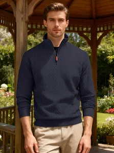 Men's navy blue half-zip jacquard sweater with standing collar in a garden gazebo