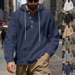 Close-up detail of men's linen striped hooded shirt with buttons, drawstring and multiple colors