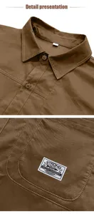 Detail view of a men's retro brown cotton work shirt featuring collar and pocket patch