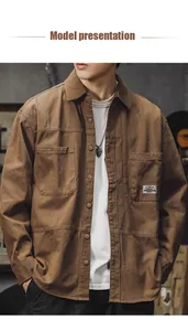 Detail view of a men's vintage brown cotton long-sleeve workwear shirt on model