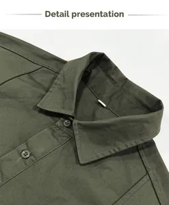 Detailed close-up of military green vintage cotton work shirt collar and stitching lines