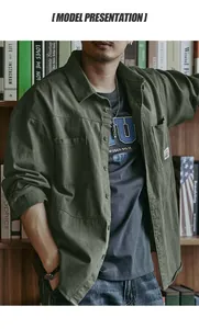 Detail view of a men's olive green retro workwear shirt styled with a casual inner tee