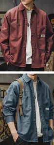 Detailed view of men's washed cotton workwear shirts in red and blue colors