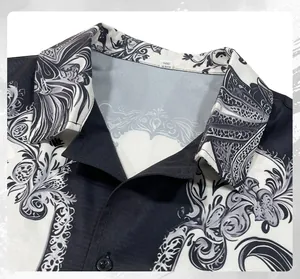 Close-up detail of a men's shirt with unique black and white ink-style patterns