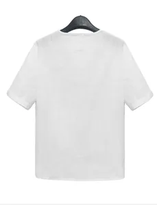 Back view of a breathable white short-sleeved shirt for men, detail of the fabric texture