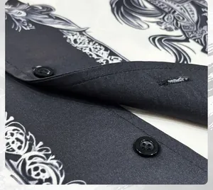 Detailed macro view showing black buttons and unique ink wash horse print on men's shirt fabric