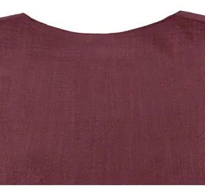Close-up detail of burgundy linen-textured fabric neckline for men's casual lightweight shirt.