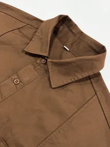 Vintage brown cotton long sleeve work shirt with classic collar and buttons