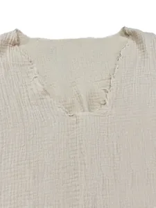 Detail shot of men's summer V-neck cotton gauze t-shirt with raw frayed edge design