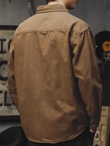 Men's brown cotton long sleeve workwear shirt shown from a back perspective