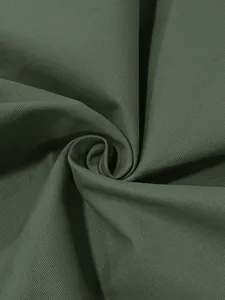 Detailed texture of olive green twill fabric for men's vintage casual long sleeve shirt