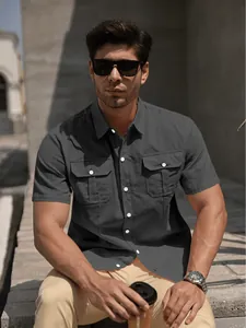 Modern men's dark grey short-sleeved cotton shirt with double chest pockets and lapel