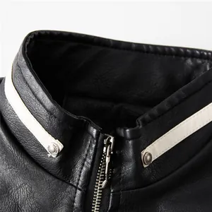 Close-up of black faux leather motorcycle jacket collar with white stripes and metal zipper