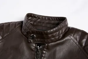Close-up view of a brown faux leather jacket collar with premium metallic zipper details