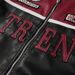 Close-up detail of the fashion color-block racing jacket featuring TREND embroidery texture