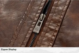 Close-up detail of a smooth metal zipper on a brown faux leather motorcycle jacket