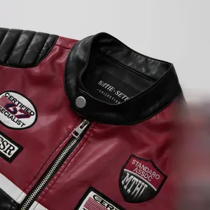 Close-up detail of red and black leather biker jacket with vintage embroidered racing patches