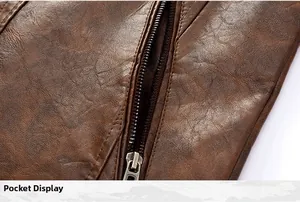Detailed view showing the metal zipper pocket of a brown faux leather motorcycle jacket