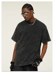 Detailed view of a heavyweight 300g snow-wash faded black t-shirt with small neck
