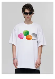 Detail of white cotton streetwear t-shirt with vibrant pill graphics and text