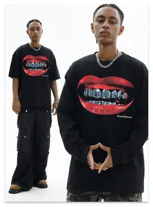 Detailed view of the red lip and silver teeth graphic print on a black street t-shirt