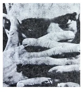 Macro detail of retro washed cotton T-shirt showing high-contrast portrait print