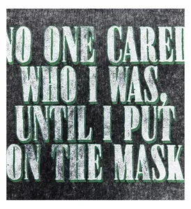 Close-up of vintage 'No One Cared' slogan print on heavyweight washed cotton T-shirt
