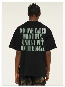 Back view of black heavyweight washed cotton t-shirt with vintage green text print