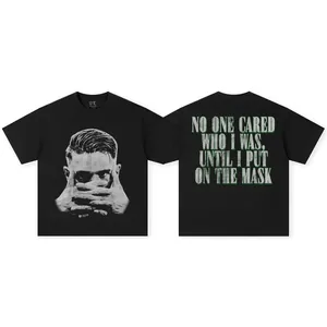 Vintage black heavy washed cotton t-shirt with Viktor Gyökeres mask graphic and quote.