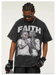 Macro view of vintage washed distressed cotton T-shirt with white ink Faith graphic print