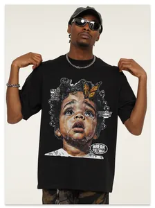 Detail of vintage black cotton T-shirt featuring crying child and butterfly graphic print.