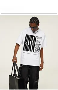 Male model in a white oversized street style T-shirt featuring a RISEN graphic print