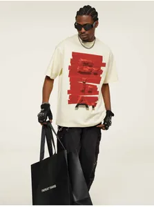 Detail view of cream heavyweight cotton T-shirt with 3D red tape BLAKE print design