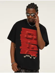 Close-up detail of black heavyweight cotton T-shirt with red 3D tape textured graphic