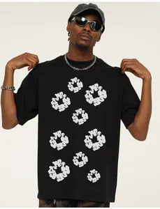 Close-up detail of a black cotton streetwear T-shirt with white popcorn graphic prints