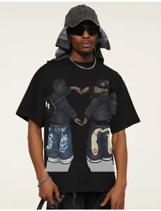 Detailed view of black American streetwear cotton T-shirt with cartoon heart hand print