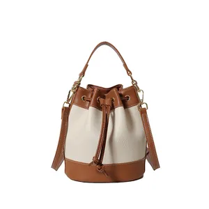 Retro contrast color bucket bag featuring drawstring closure and top handle strap
