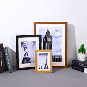 Set of minimalist wooden picture frames in various sizes for wall and tabletop decor.