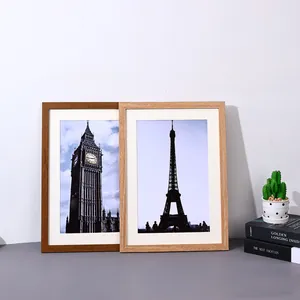 Set of two minimalist wooden picture frames for A3/A4 photos shown in a home setting