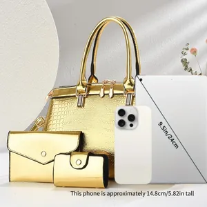 Gold Boston 3-piece bag set compared with tablet and phone for size scale demonstration.