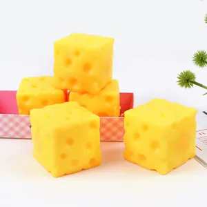 Macro view of realistic yellow Swiss cheese square squishy slow rebound food toys
