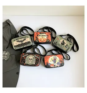 Details of Halloween printed crossbody bags with various spooky patterns and wide straps