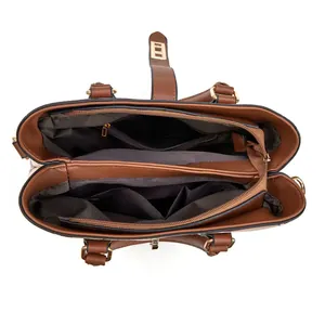Interior detail of brown women's tote bag showing multiple compartments and zipper pockets