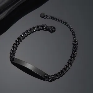 Detail view of the sleek black stainless steel curved plate and Cuban chain links