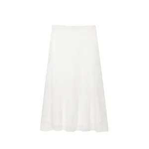 Detailed close-up view of a minimalist white linen midi skirt with natural fiber texture