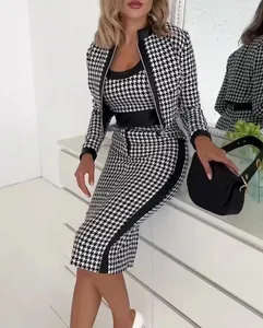 Detailed view of women's fashionable black and white houndstooth three-piece outfit
